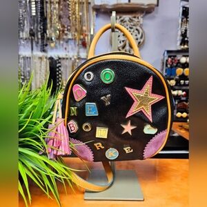 Dooney & Bourke Black Backpack with Colorful Lettering